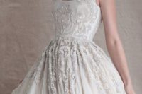 27 thin straps, a heavily embellished bodice with a scoop neck, A-line wedding dress