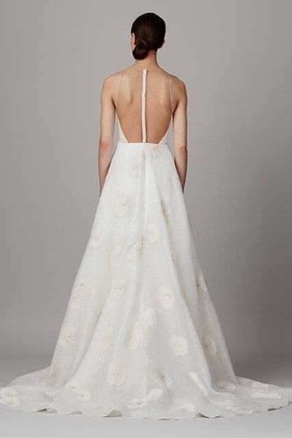 modern wedding gown with lace appliques and an illusion racerback