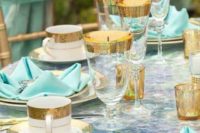 28 table decor with gold rim glasses and cups and a mother of pearl tablecloth