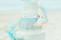 28 watercolor light blue wedding cake with sirl decor and shells
