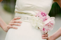 29 embellish your wedding sash with cool fresh blooms