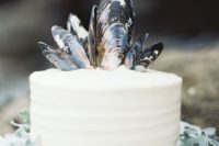 29 one-tier wedding cake topped with mussel shells