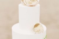 30 elegant white cake topped with oyster shells and greenery