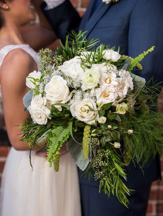 large chic textural bouquet with lots of greenery and blush and white flowers
