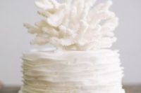 30 one-tier ruffled wedding cake topped with corals