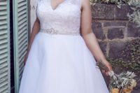 30 wide strap wedding dress with a lace bodice and a bejeweled sash