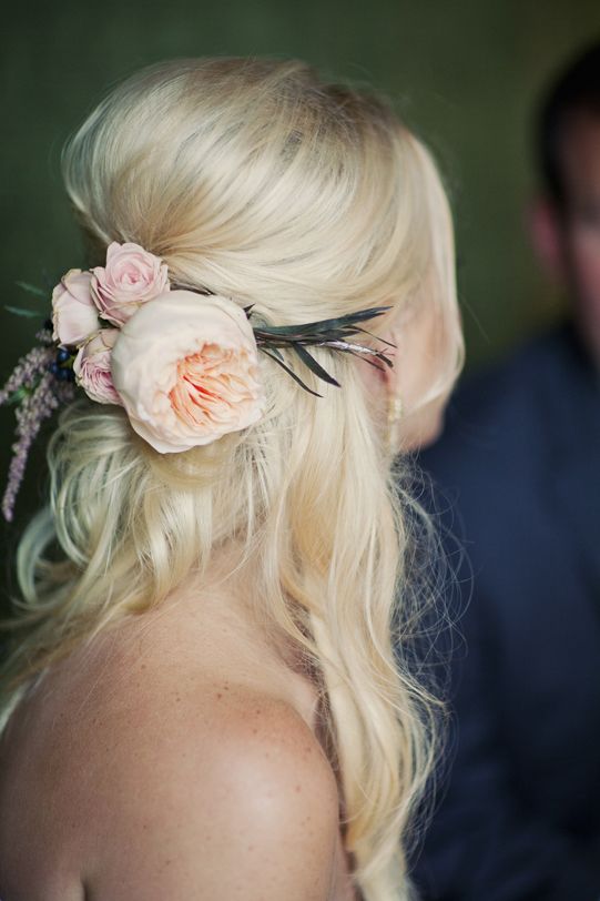 messy half updo with blush blooms