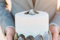 31 ombre blue wedding cake with shell decor