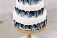 32 wedding cake covered with oyster shellls in a unique piece