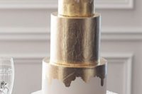 33 white and gold metallic wedding cake with a blush bloom