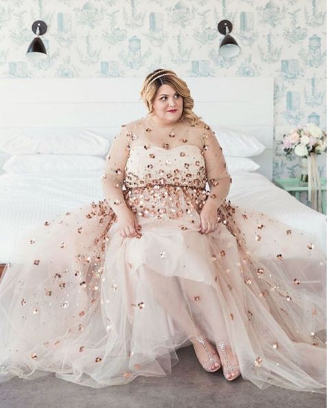 blush wedding dress with a sheer bodice and rose gold sequins all over