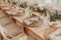 36 Toscana styled wedding reception with olive branches and wicker place settings