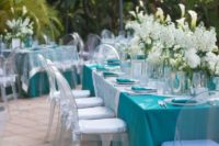 37 turquoise and white poolside reception with flowers
