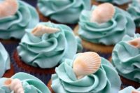 38 turquoise shell-topped cupcakes