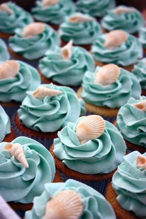 turquoise shell-topped cupcakes