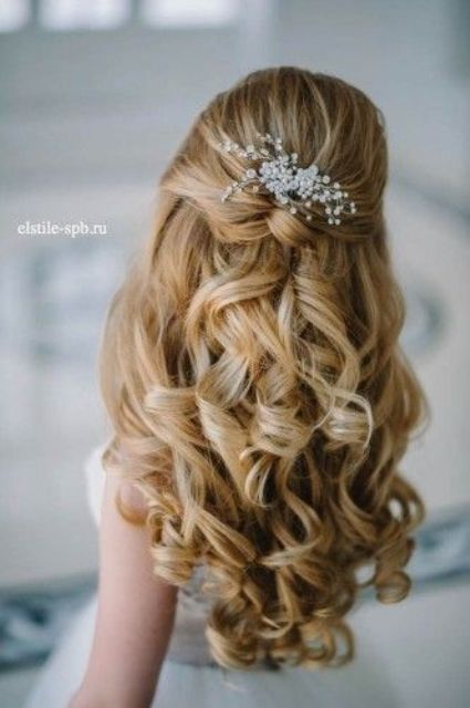 half up half down curly hairstyle with just some baby's breath