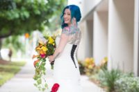 02 The bride was rocking a strapless fit and flare wedding dress with black lacing and bold blue hair
