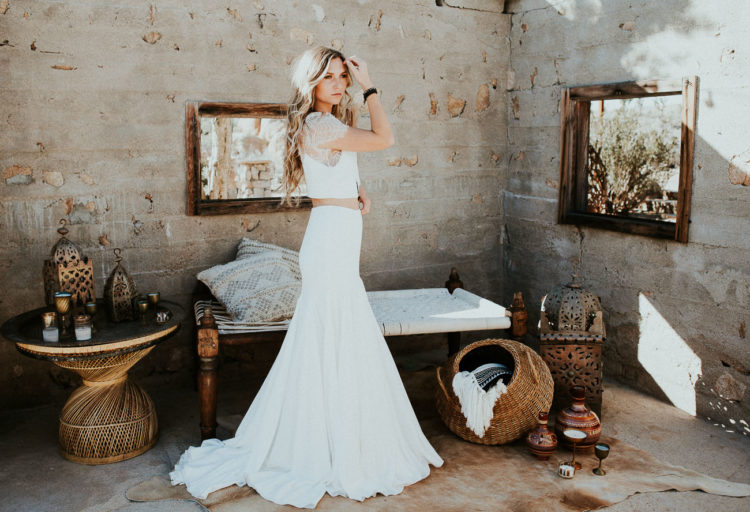 The first wedding outfit is a bridal separate with a lace top with short sleeves and a mermaid plain skirt