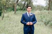 02 The groom was wearing a stylish navy suit with a vest and tie and ocher shoes for a stylish look