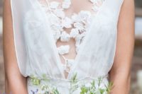 02 a flowy wedding dress with a lace flower top and thick straps over it