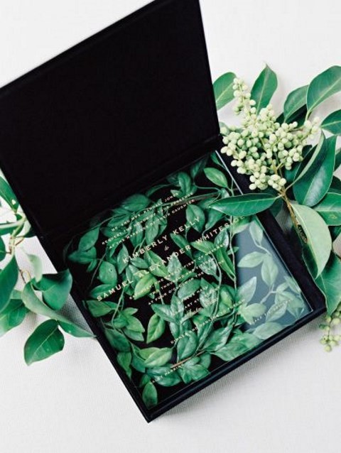 acrylic wedding invitation in a box with fresh leaves makes a statement