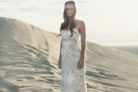 02 strapless embellished wedding dress with a train and a headpiece with rhinestones