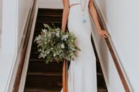 03 sleeveless wedding dress with small side cutouts and a train