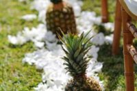 04 white orchids and pineapples for lining up the aisle