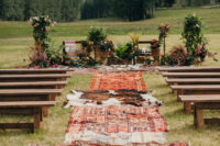 06 The ceremony spot was decorated with greenery and flowers and covered with rugs that bride had brought from her trips