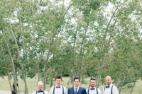 06 The groomsmen rocked grey pants, white shirts and navy suspenders and bow ties