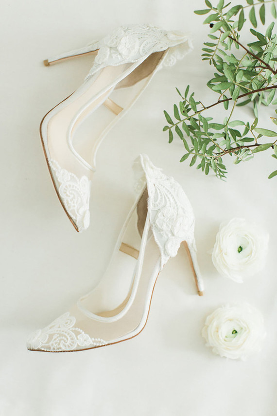 delicate white lace bridal heels with sheer parts look stunning