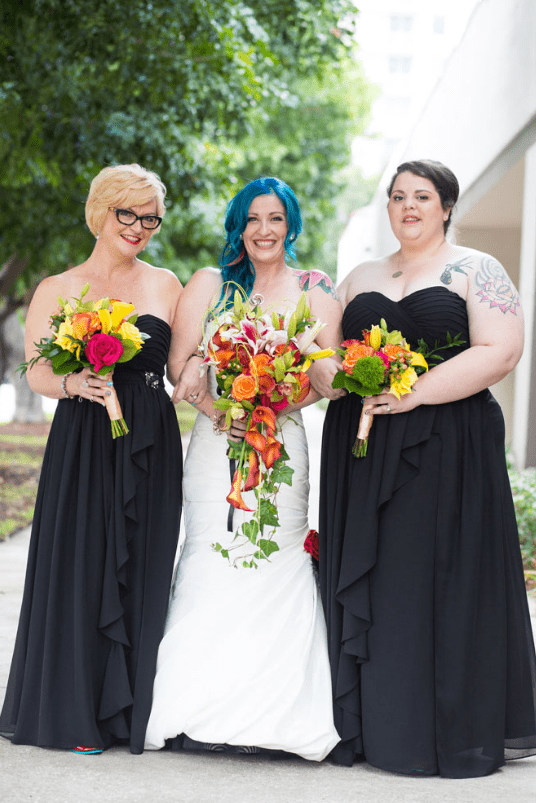 The bridesmaids were wearing strapless black gowns