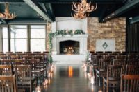 07 The ceremony spot was decorated with geometric candle lanterns, antler chandeliers and greenery garlands