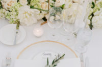 08 Gold table numbers, platters and candles make this table setting gorgeous