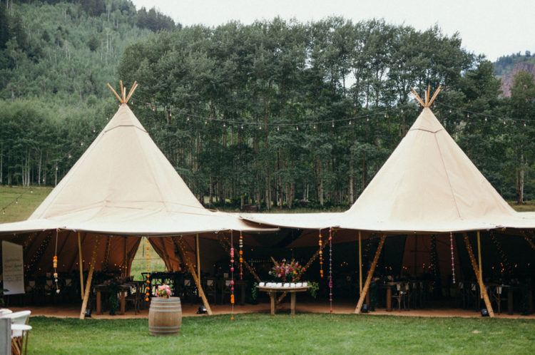 The reception and dinner took place under teepees as it's a boho wedding