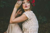 08 an ivory flowing skirt and a crochet lace top with short sleeves, a bold flower crown