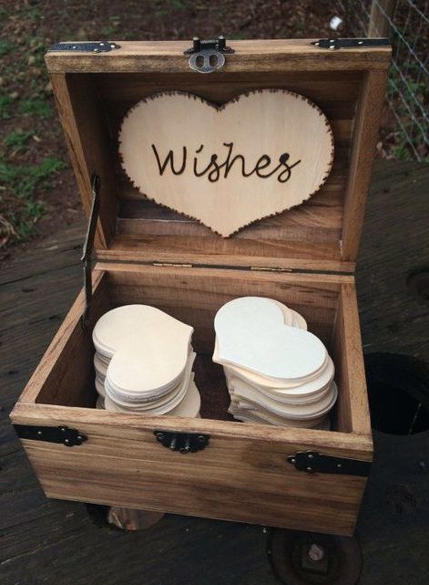 wooden box with a wooden heart and heart-shaped paper