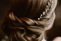 09 The bride was rocking a twisted updo with a rhinestone headpiece
