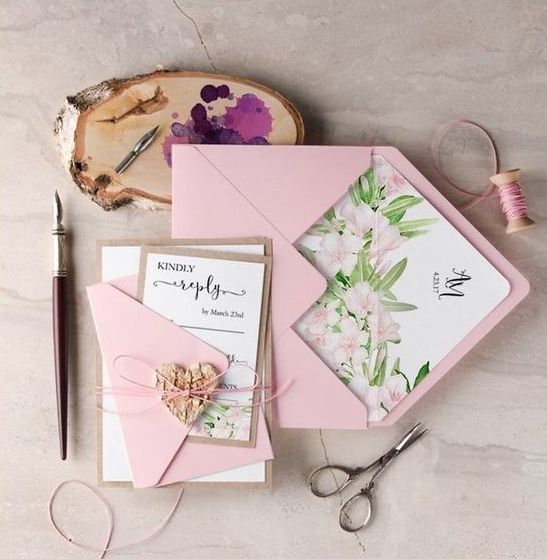 pink envelopes and pink flower wedding invites