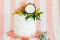 09 textural wedding cake with greenery and a coconut