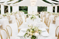 11 The wedding reception was covered with draped fabric cover, glam chandeliers