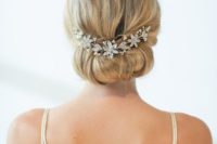 11 a simple updo with a crystal hair vine of silver flowers