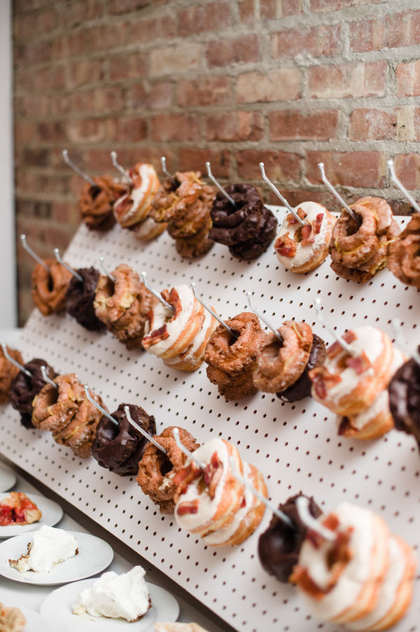 Donut station on a pegboard is a hot trend for modern weddings
