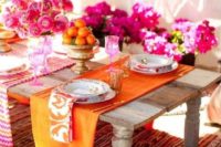12 bold and colorful wedding table in tangerin and fuchsia shades