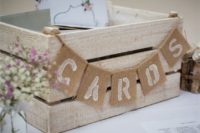 12 whitewashed wooden crate with a burlap banner