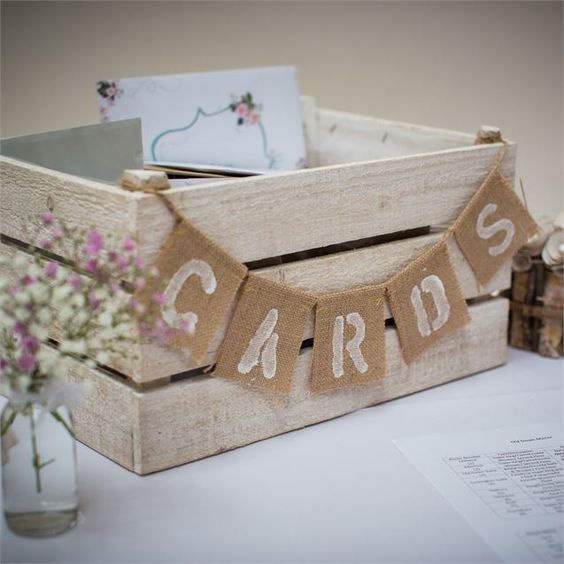 whitewashed wooden crate with a burlap banner