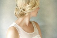 13 a simple updo with a delicate pearl hair vine