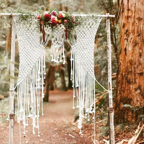 birch branch wedding arch with macrame and bold florals