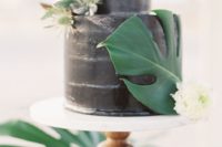 13 black wedding cake with a palm leaf and thistle