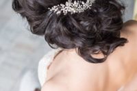 15 wavy updo with a hair vine of pearls and sparkling crystals